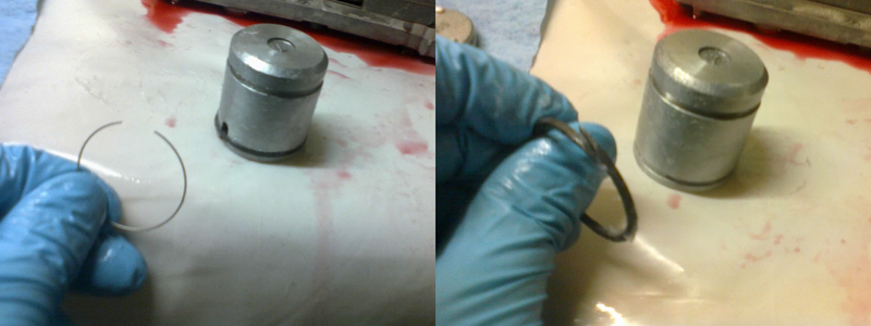 Another part of the shift kit involves slipping this tiny little wire into the 2-4 piston groove before adding the scarf-cut seal ring. Though the piston has two grooves, only the one near the closed end of the piston needs the expander ring under the seal.